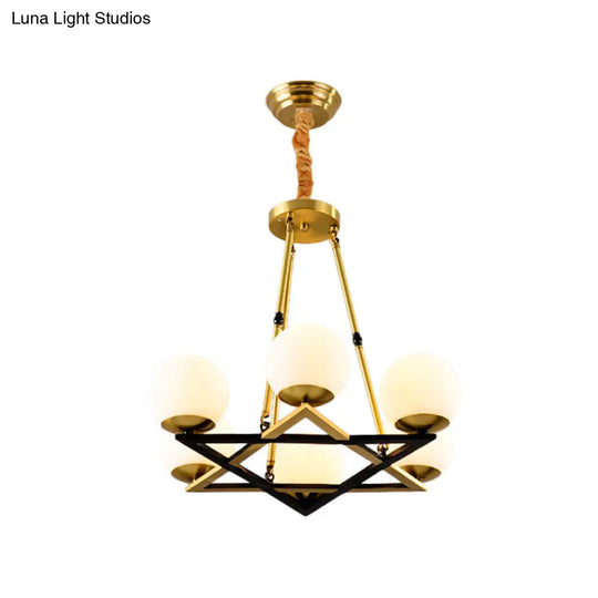 Postmodern Polygon Metal Chandelier With Brass Finish And Globe White Glass Shades