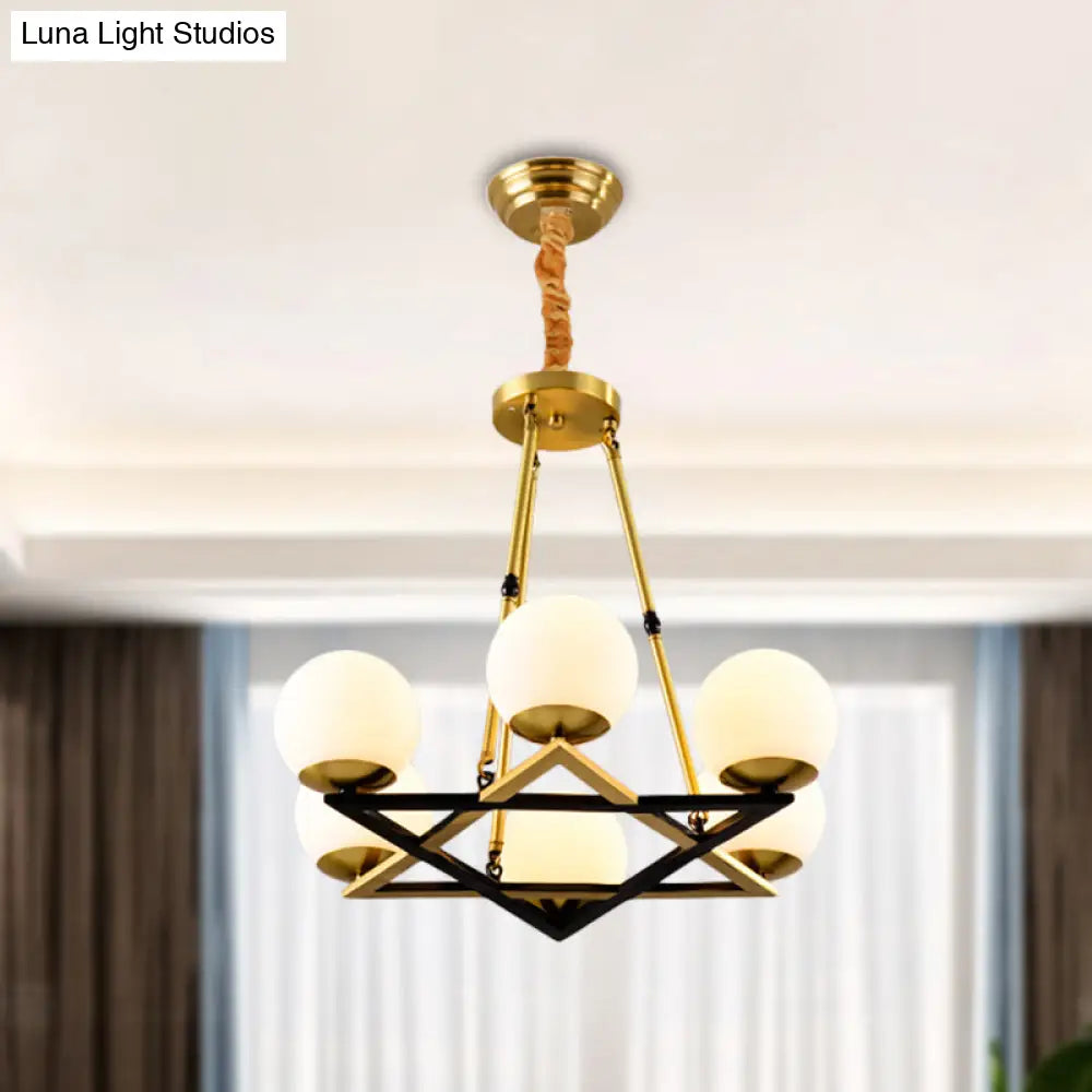 Postmodern Polygon Metal Chandelier With Brass Finish And Globe White Glass Shades