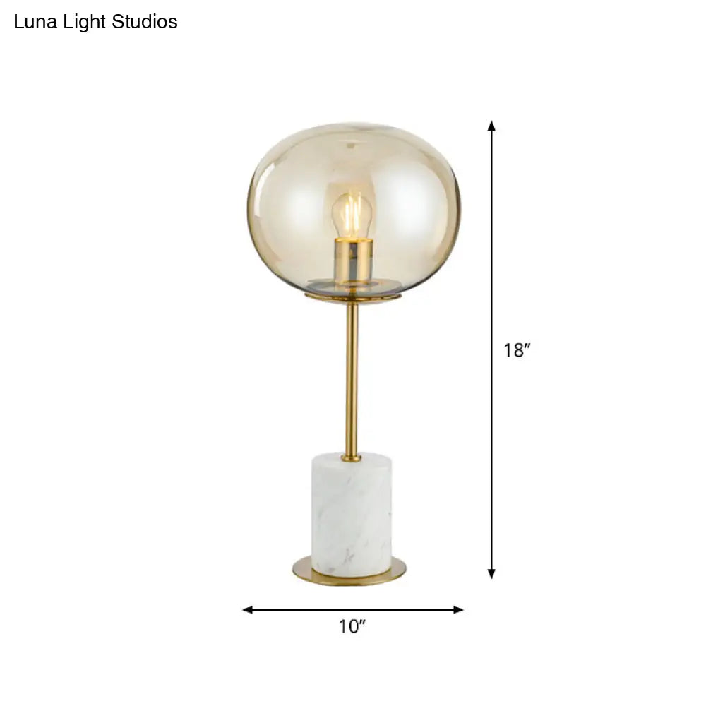 Clear Glass Night Light With Minimalist Oval Design Brass Accents And Marble Base