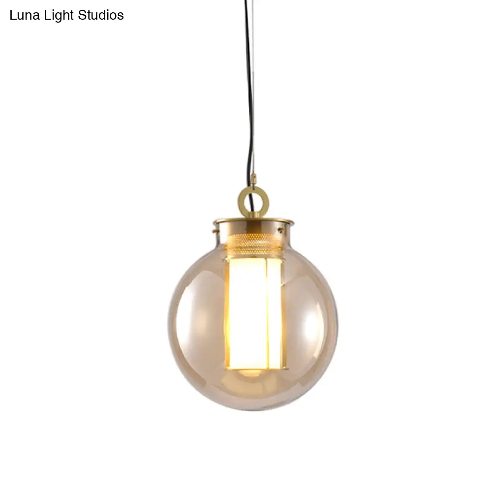Retro Gold Pendulum Light With Amber Glass Sphere/Ellipse/Oblong Design And Tube Frame Insert