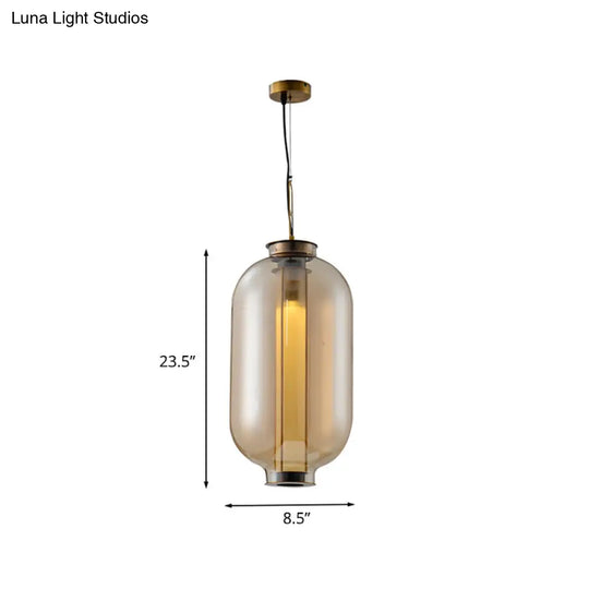 Retro Gold Pendulum Light With Amber Glass Sphere/Ellipse/Oblong Design And Tube Frame Insert