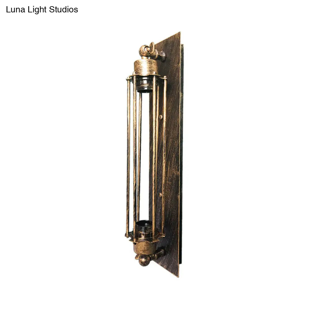 Retro Industrial Wall Sconce Lighting: Linear Wrought Iron Lamp With Cage Shade In Aged Brass