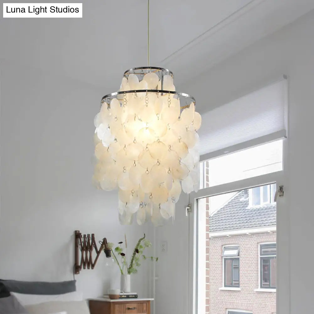 Retro Shell Silver Pendant Lighting For Tiered Dining Rooms