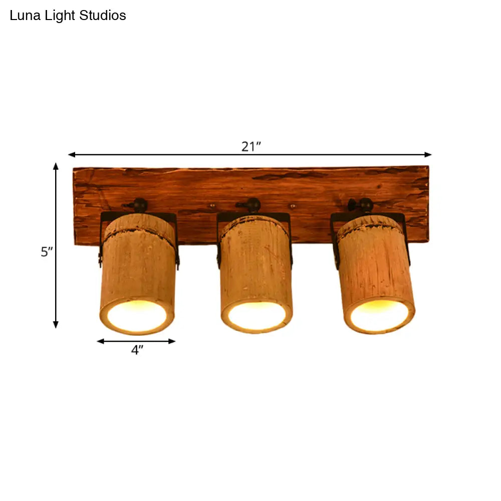 Rustic Bamboo Wall Sconce With Linear Wood Backplate