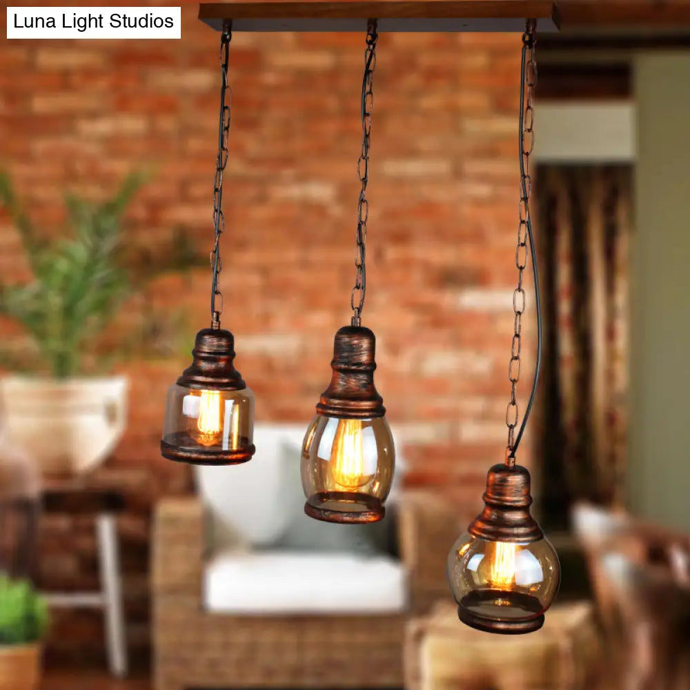Rustic Clear Glass Pendant Light For Coffee Shop Ceiling - 1 Rust Bottle Shade Multi Linear Canopy