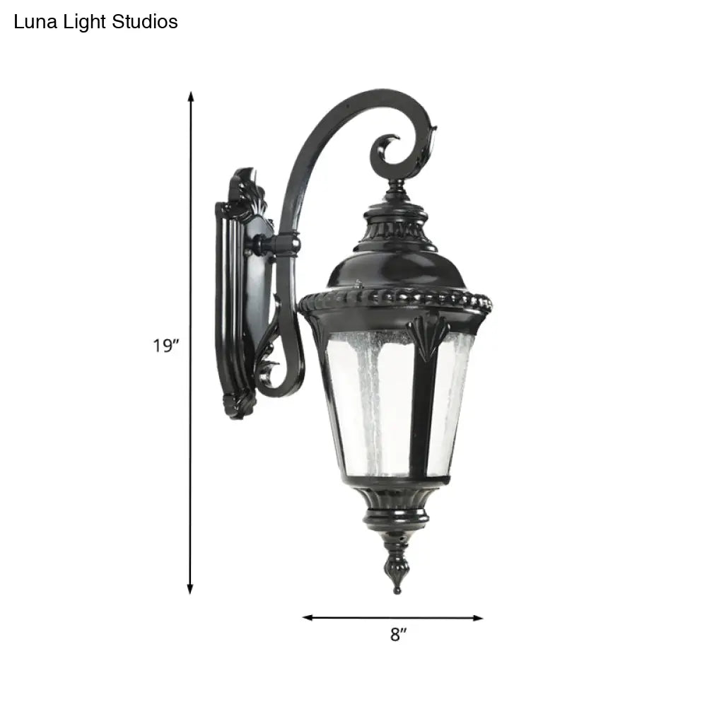 Rustic Courtyard Wall Lighting: 1-Light Sconce With Urn Clear Seeded Glass Shade In Black