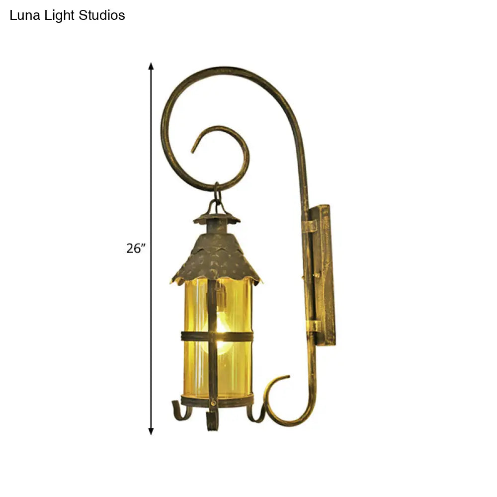 Rustic Lantern Wall Mounted Light Fixture With Scroll Arm In Antique Bronze