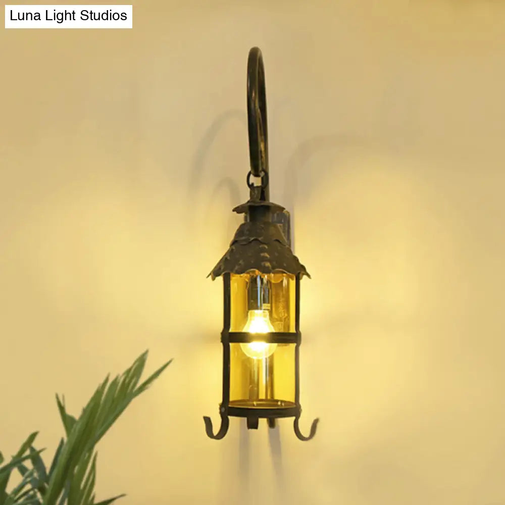 Rustic Lantern Wall Mounted Light Fixture With Scroll Arm In Antique Bronze