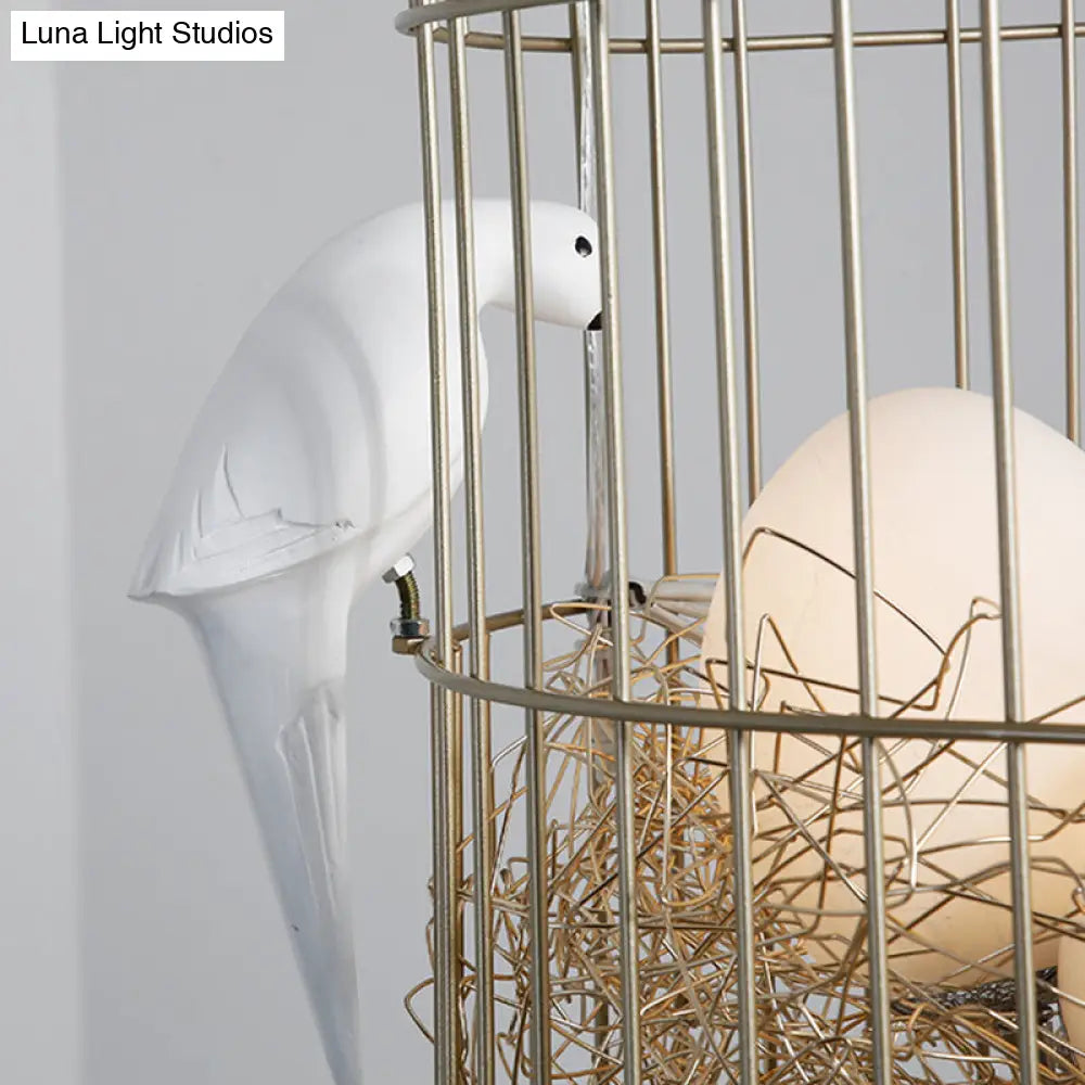 Rustic Matte White Glass Egg Shaped Chandelier With Bird And Birdcage - 3 Light Hanging Fixture