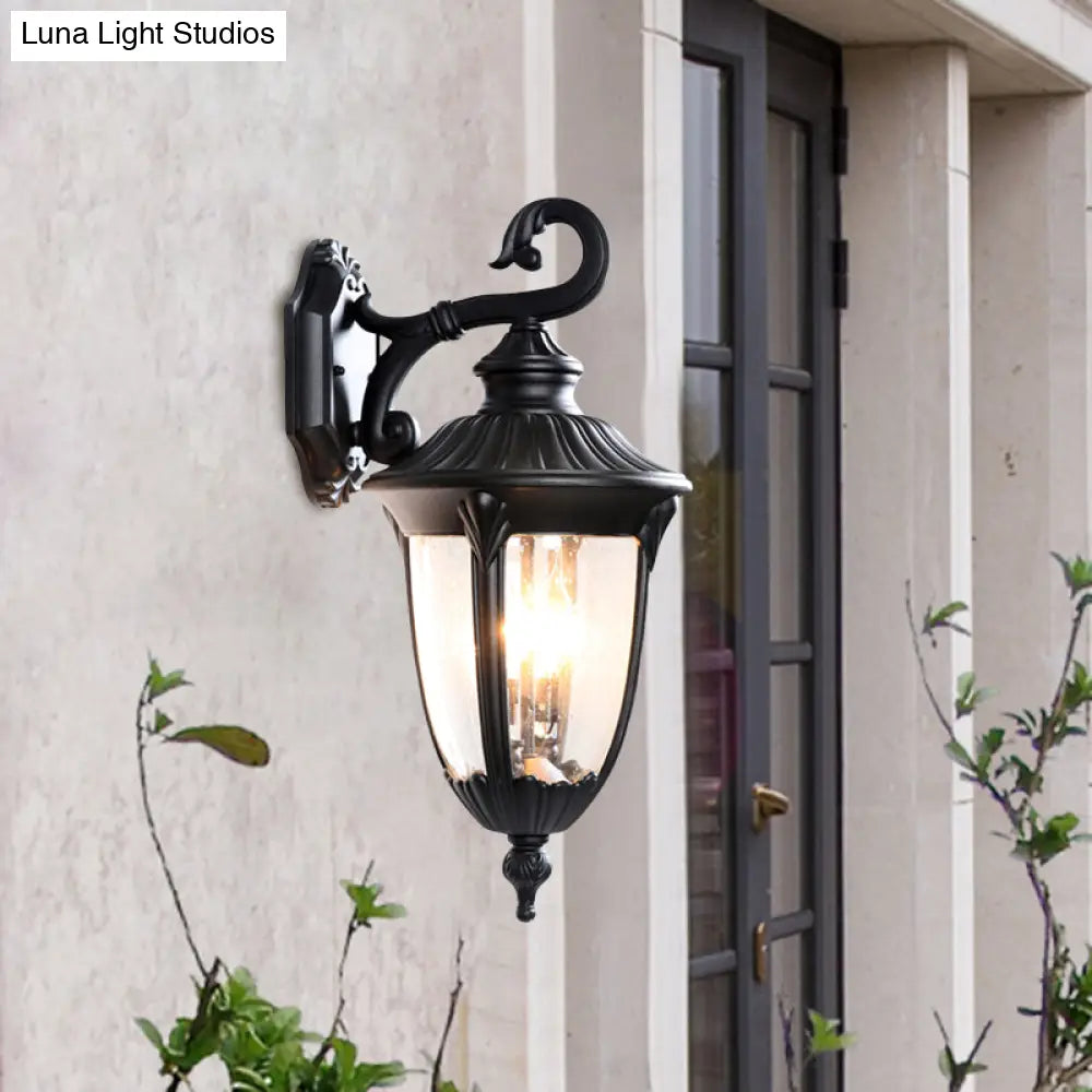 Rustic Outdoor Wall Lamp: Clear Bubble Glass Black Sconce Urn With Curling Arm [1-Head Fixture]