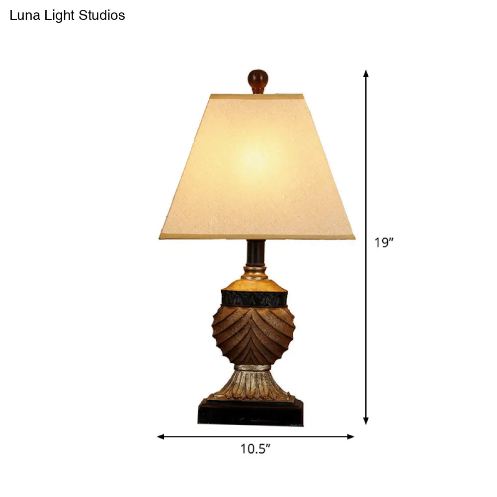 Rustic Pinecone Table Lamp With Resin Base And Trapezoid Fabric Shade