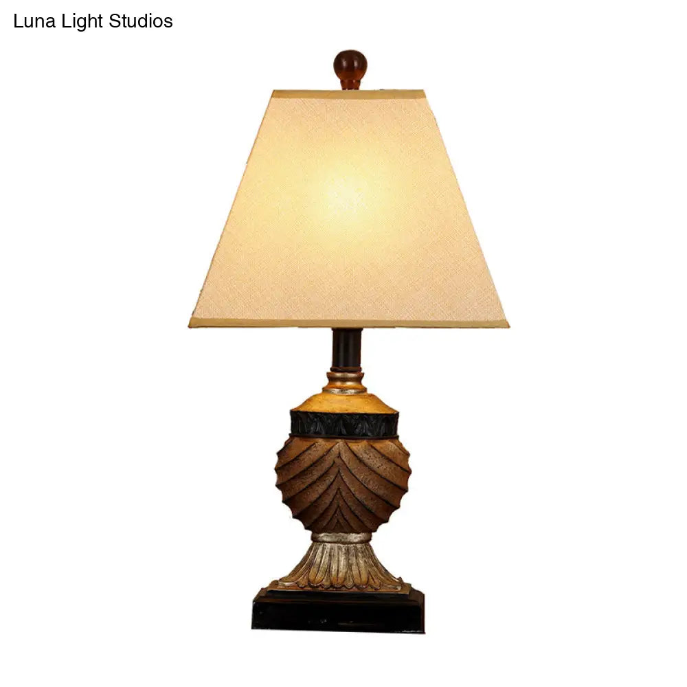 Rustic Pinecone Table Lamp With Resin Base And Trapezoid Fabric Shade