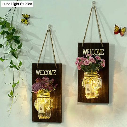 Rustic Style Clear Glass Shade Wall Sconce With Purple Flower String Lights For Cafe