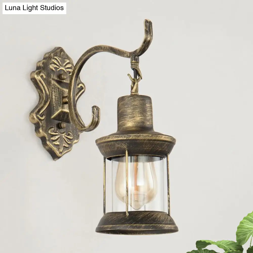 Rustic Wall Mounted Kerosene Light Fixture With Carved Pattern - Aged Bronze Finish Clear Glass