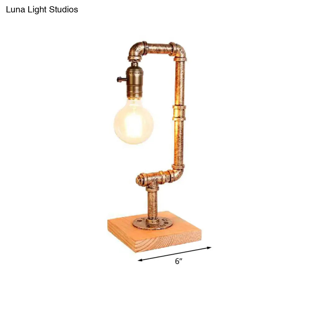 Rustic Wrought Iron Table Lamp With Stylish Open Bulb - Bedroom Lighting In Bronze