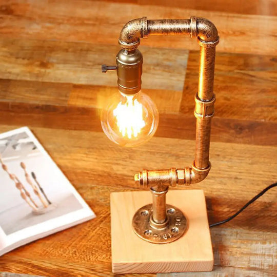 Rustic Wrought Iron Table Lamp With Stylish Open Bulb - Bedroom Lighting In Bronze