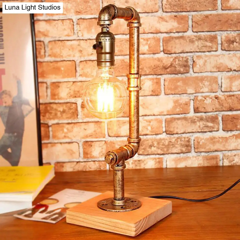 Rustic Wrought Iron Table Lamp With Stylish Open Bulb - Bedroom Lighting In Bronze