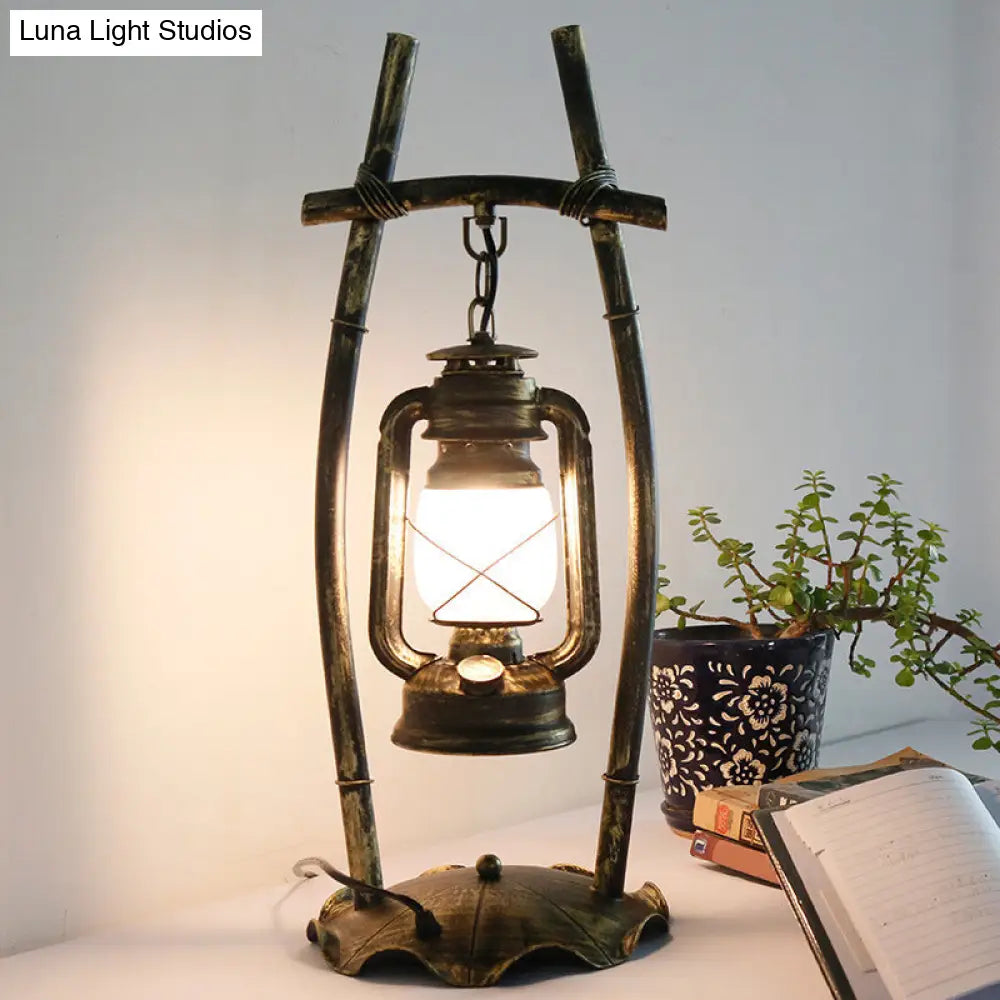 Opal Glass Kerosene Table Light With Antiqued Brass Frame And Farmhouse-Inspired Design