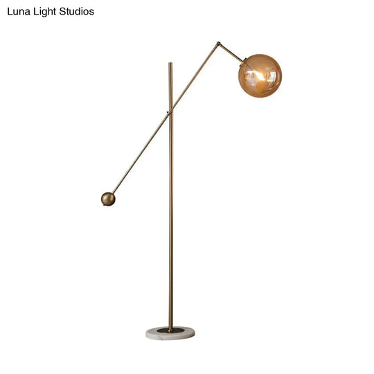 Simplicity 1-Light Bronze Amber Glass Sphere Floor Lamp With Balance Arm