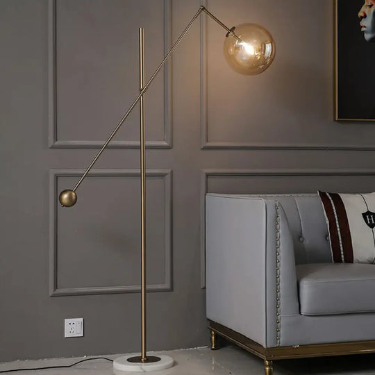 Simplicity 1-Light Bronze Amber Glass Sphere Floor Lamp With Balance Arm