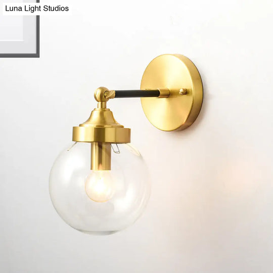 Simplicity Adjustable Globe Sconce Light Brass Wall Mount Lamp - 1 Bulb With Transparent Glass Shade