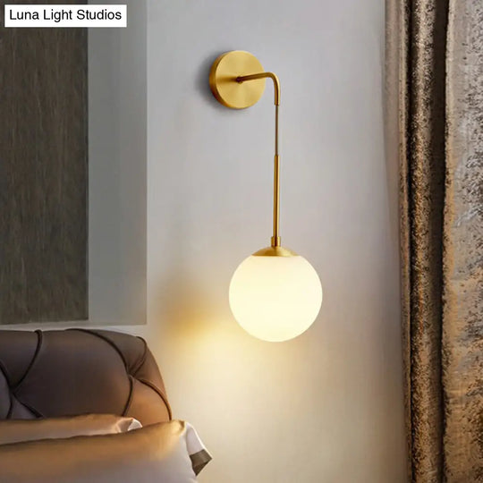 Simplicity White Glass Wall Sconce - Brass Finish Bedroom Light Fixture With 1 Bulb