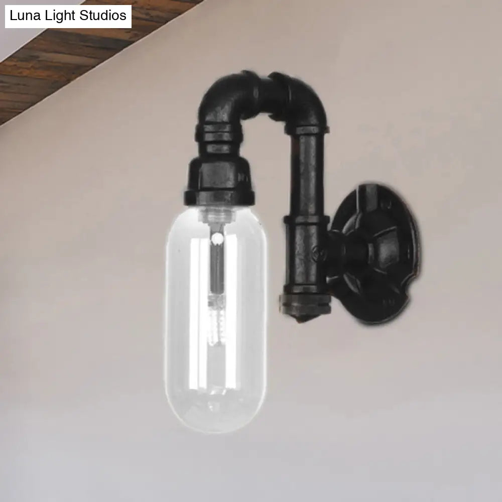 Single Bulb Industrial Wall Sconce With Clear Glass Shade And Black Pipe Mount