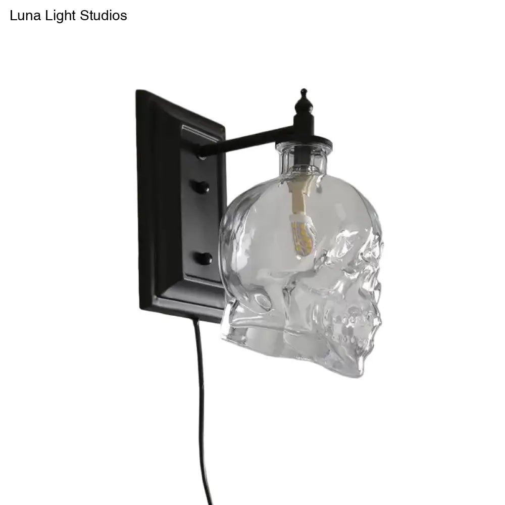 Skull Sconce Lamp - Clear Glass Decorative Wall Mounted Lighting Fixture With 1-Light In Black