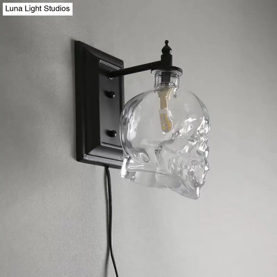 Skull Sconce Lamp - Clear Glass Decorative Wall Mounted Lighting Fixture With 1-Light In Black