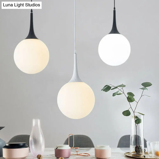 Sleek Cream Glass Pendant Light For Dining Room Minimalist Spherical Suspension