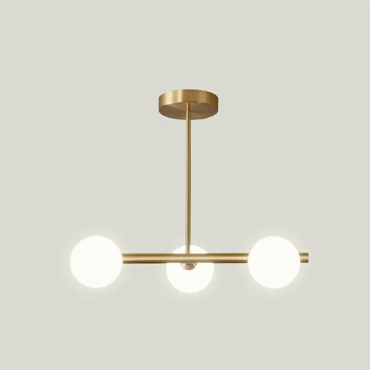 Sleek And Elegant Linear Gold Island Pendant Lighting With Spherical Glass Shades For Dining Table