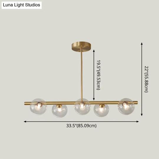 Sleek And Elegant Linear Gold Island Pendant Lighting With Spherical Glass Shades For Dining Table