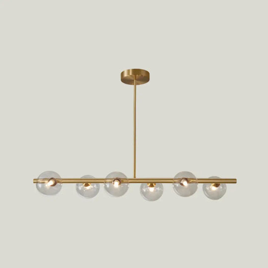 Sleek And Elegant Linear Gold Island Pendant Lighting With Spherical Glass Shades For Dining Table