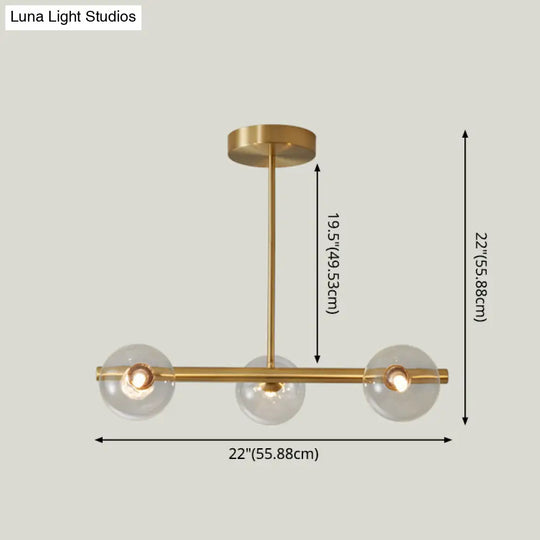 Sleek And Elegant Linear Gold Island Pendant Lighting With Spherical Glass Shades For Dining Table