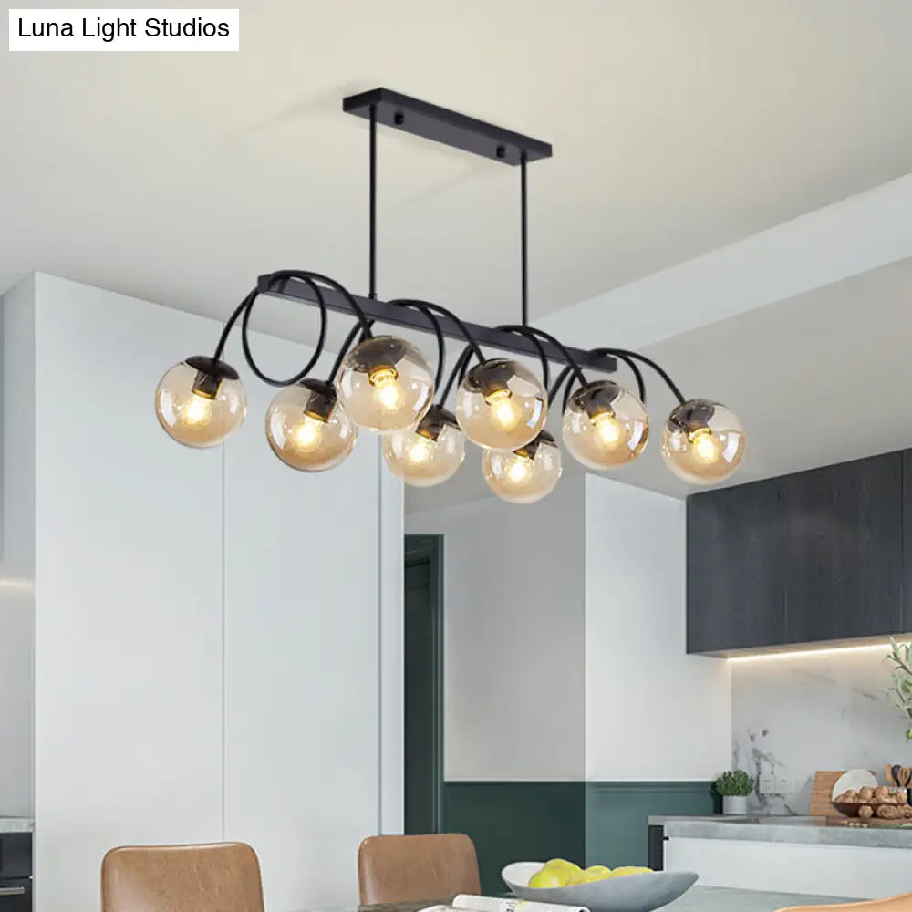 Sleek Black Glass Sphere Island Light For Modern Dining Rooms