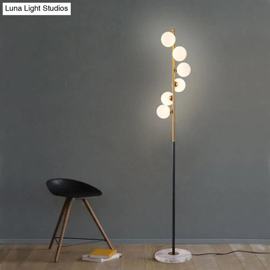 Sleek Black-Gold Led Floor Lamp With Glass Stand And Spiral Design For Study Room