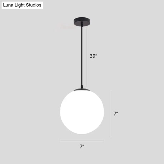 Sleek Black Sphere Restaurant Pendant Light With Cream Glass Shade - Simple Ceiling Hang Lamp