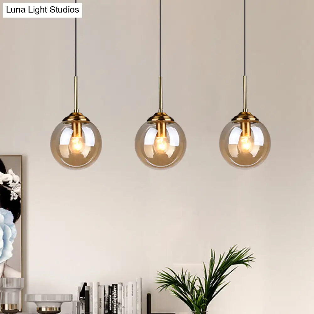 Brass Pendant Lamp With Spherical Amber/Smoke Glass Shade For Dining Room Ceiling