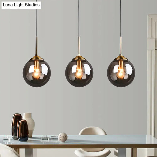 Brass Pendant Lamp With Spherical Amber/Smoke Glass Shade For Dining Room Ceiling