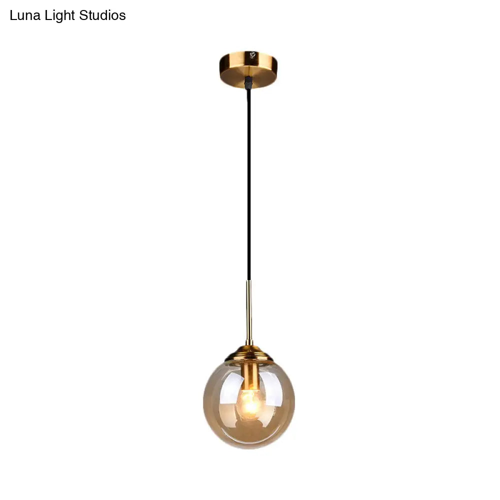 Brass Pendant Lamp With Spherical Amber/Smoke Glass Shade For Dining Room Ceiling