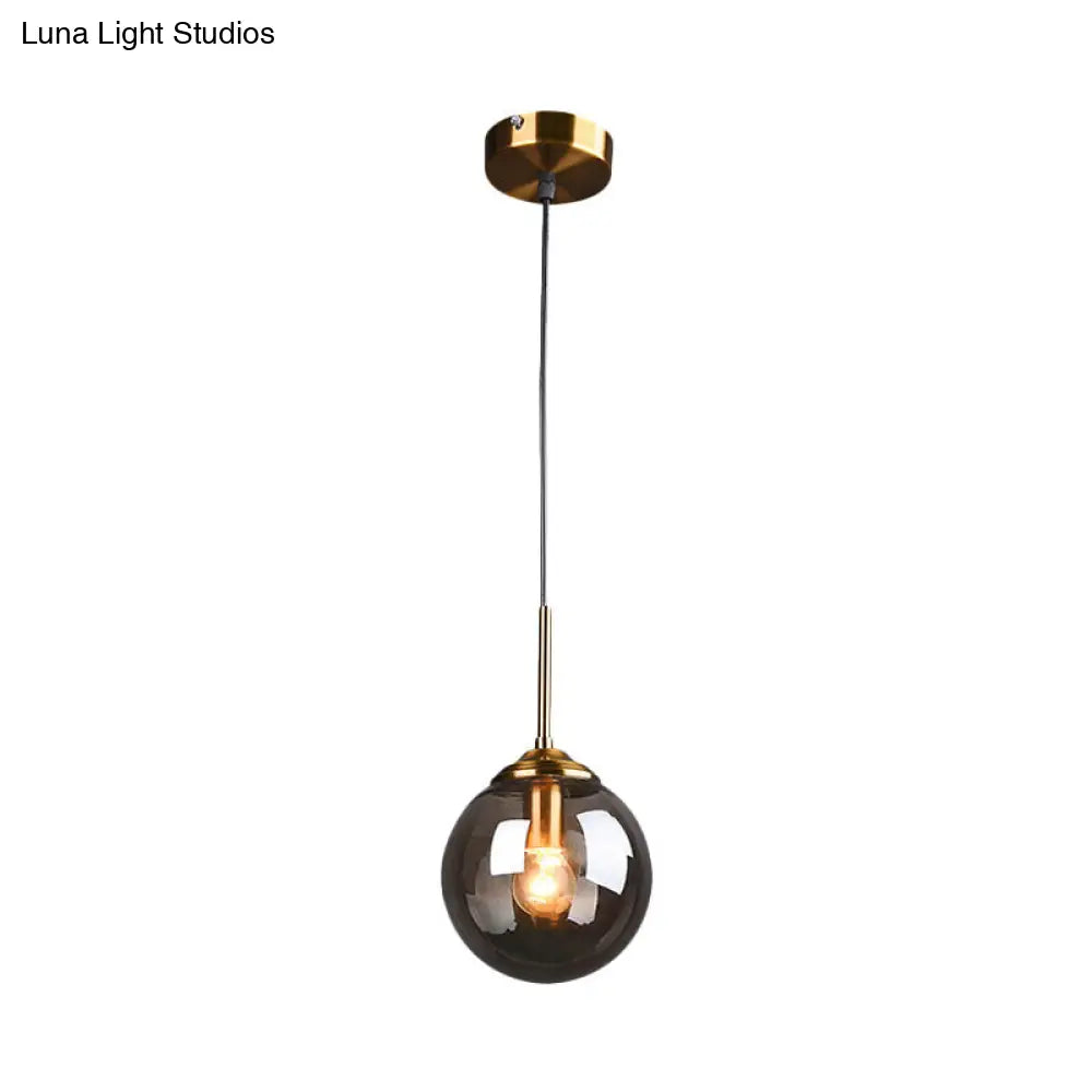 Brass Pendant Lamp With Spherical Amber/Smoke Glass Shade For Dining Room Ceiling
