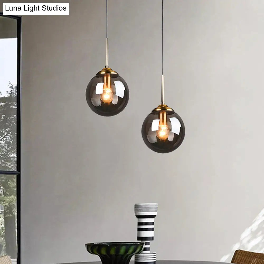 Brass Pendant Lamp With Spherical Amber/Smoke Glass Shade For Dining Room Ceiling