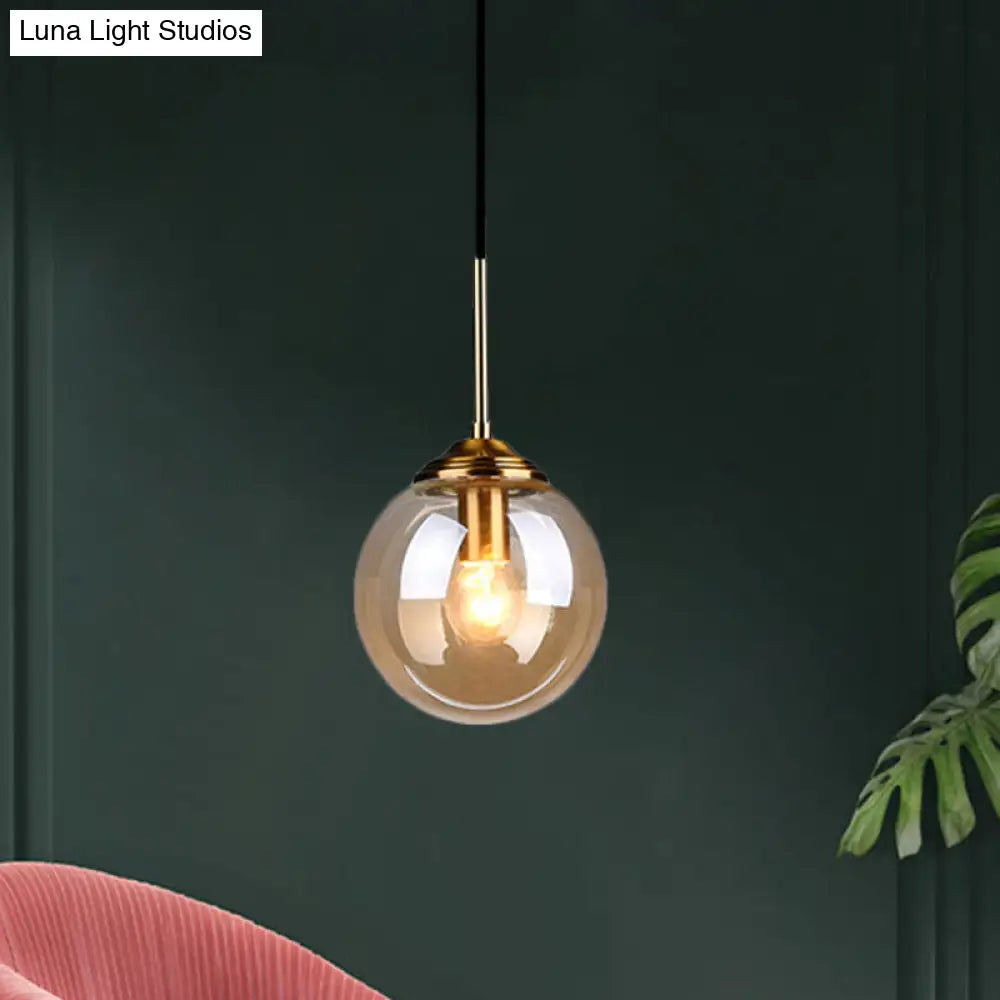 Brass Pendant Lamp With Spherical Amber/Smoke Glass Shade For Dining Room Ceiling Amber