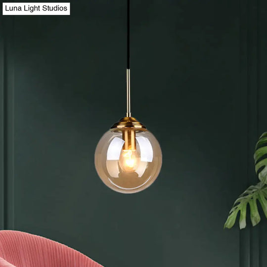 Brass Pendant Lamp With Spherical Amber/Smoke Glass Shade For Dining Room Ceiling Amber