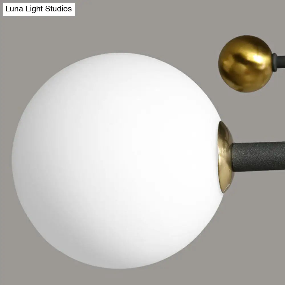 Sleek Cream Glass Ball Semi Mount Ceiling Light With Minimalistic Black And Brass Accents For Dining