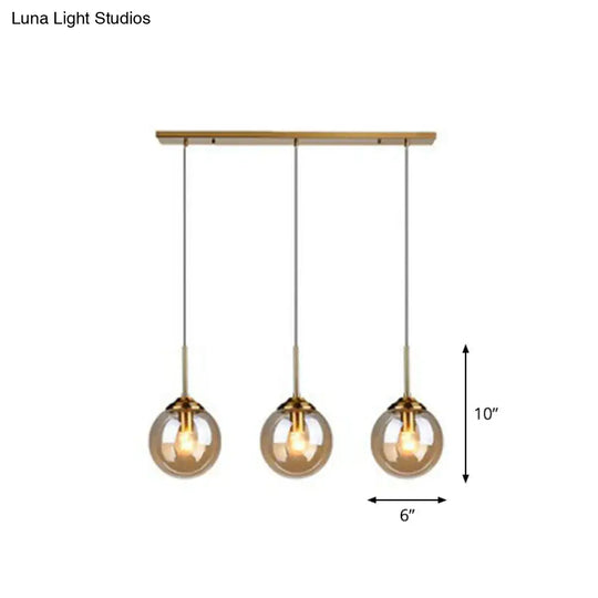 Sleek Glass 3-Bulb Brass Suspension Pendant Light For Minimalistic Dining Room Decor