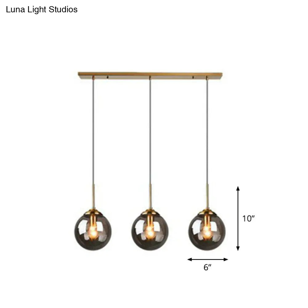 Sleek Glass 3-Bulb Brass Suspension Pendant Light For Minimalistic Dining Room Decor