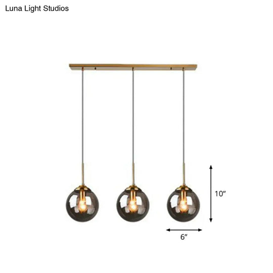 Sleek Glass 3-Bulb Brass Suspension Pendant Light For Minimalistic Dining Room Decor