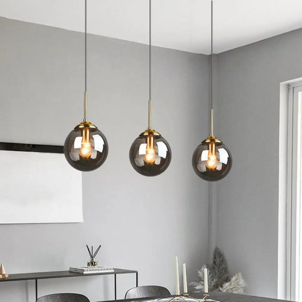 Sleek Glass 3-Bulb Brass Suspension Pendant Light For Minimalistic Dining Room Decor Smoke Gray