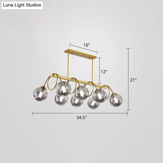 Sleek Gold Spiral Island Light - Post-Modern Metal Ceiling Hang Lamp With Ball Glass Shade